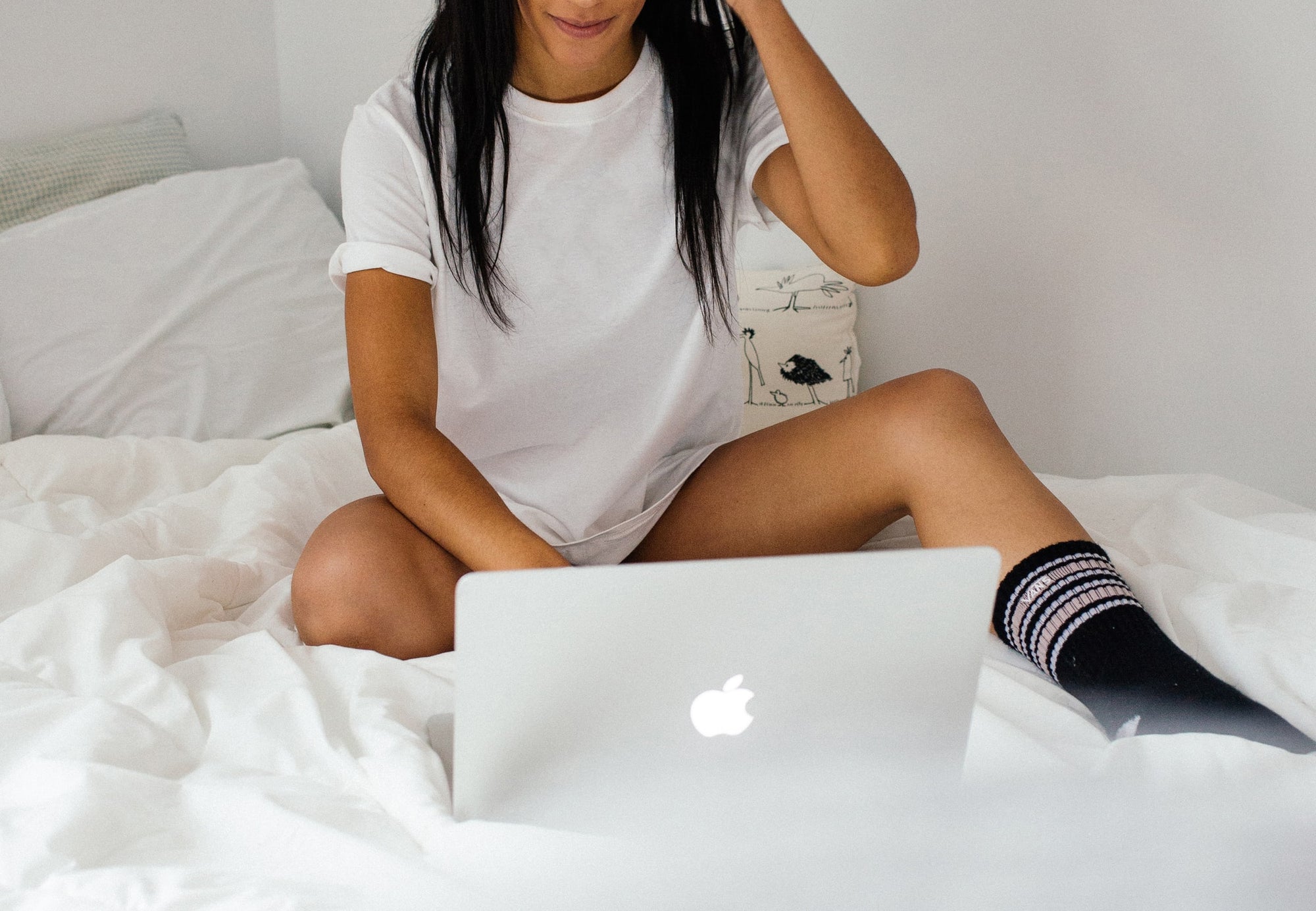 Woman with a laptop - keeping your sex-life alive in a long-distance relationship